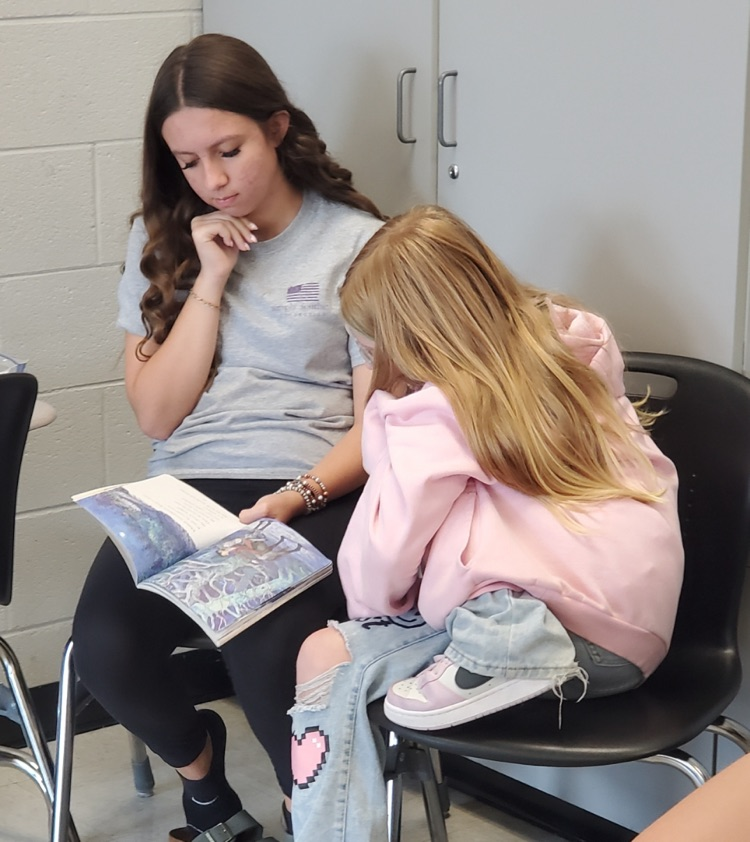 Students are partner reading. 