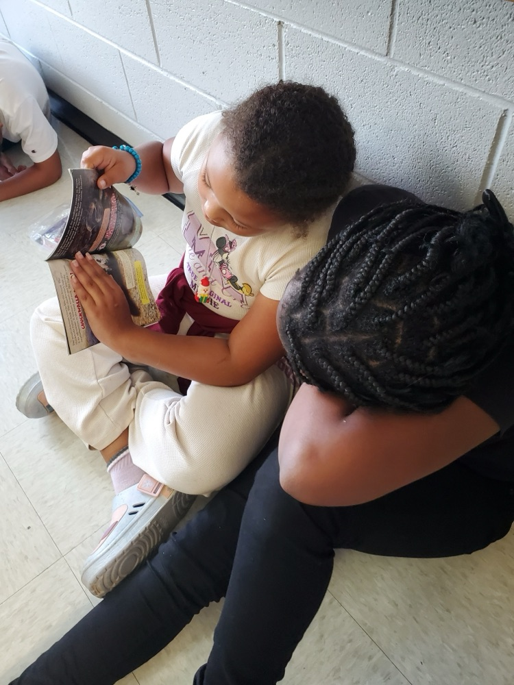 Students are partner reading. 