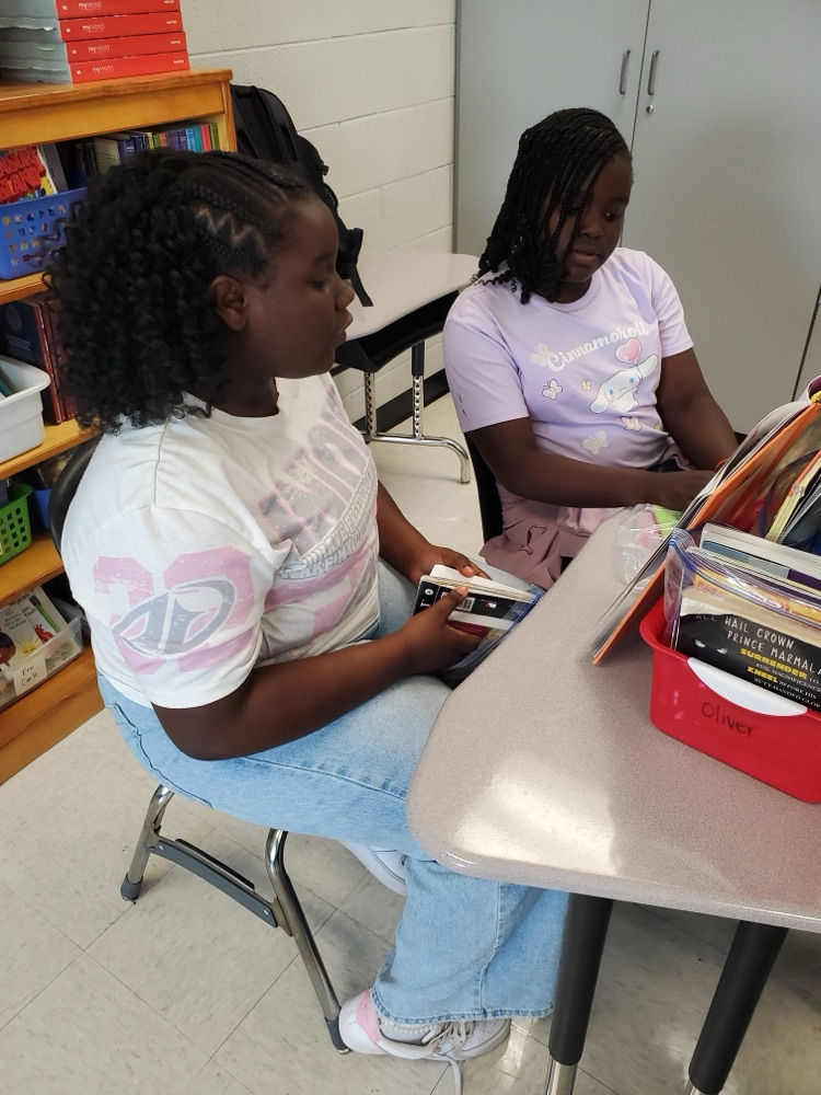 Students are partner reading. 