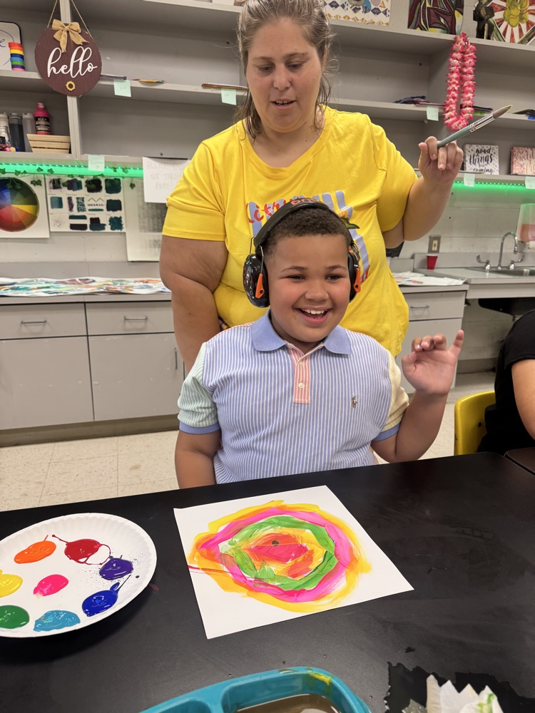 Students enjoying art. 