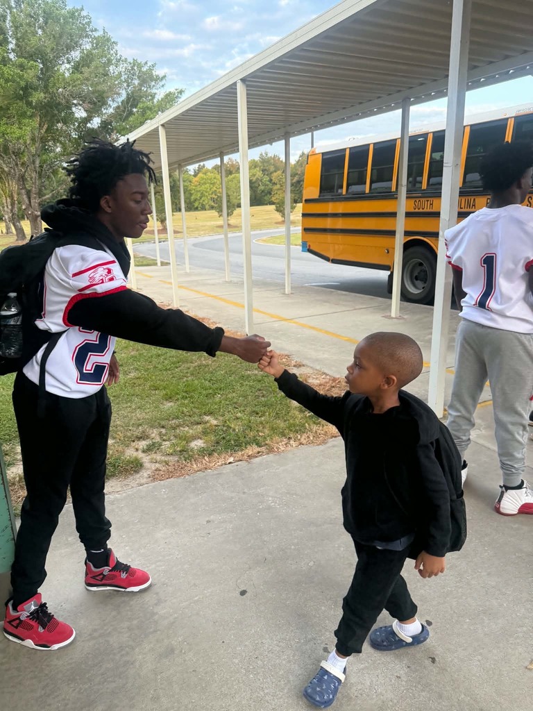 CHS Football players welcomed students to school.
