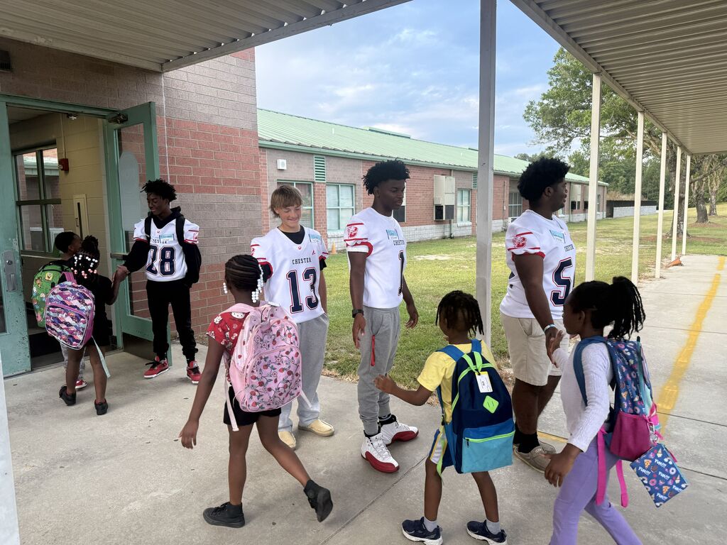 CHS Football players welcomed students to school.
