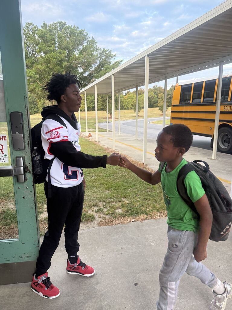 CHS Football players welcomed students to school.