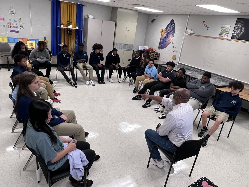 Mr. Travis Commodore interacting with the students of TLC.