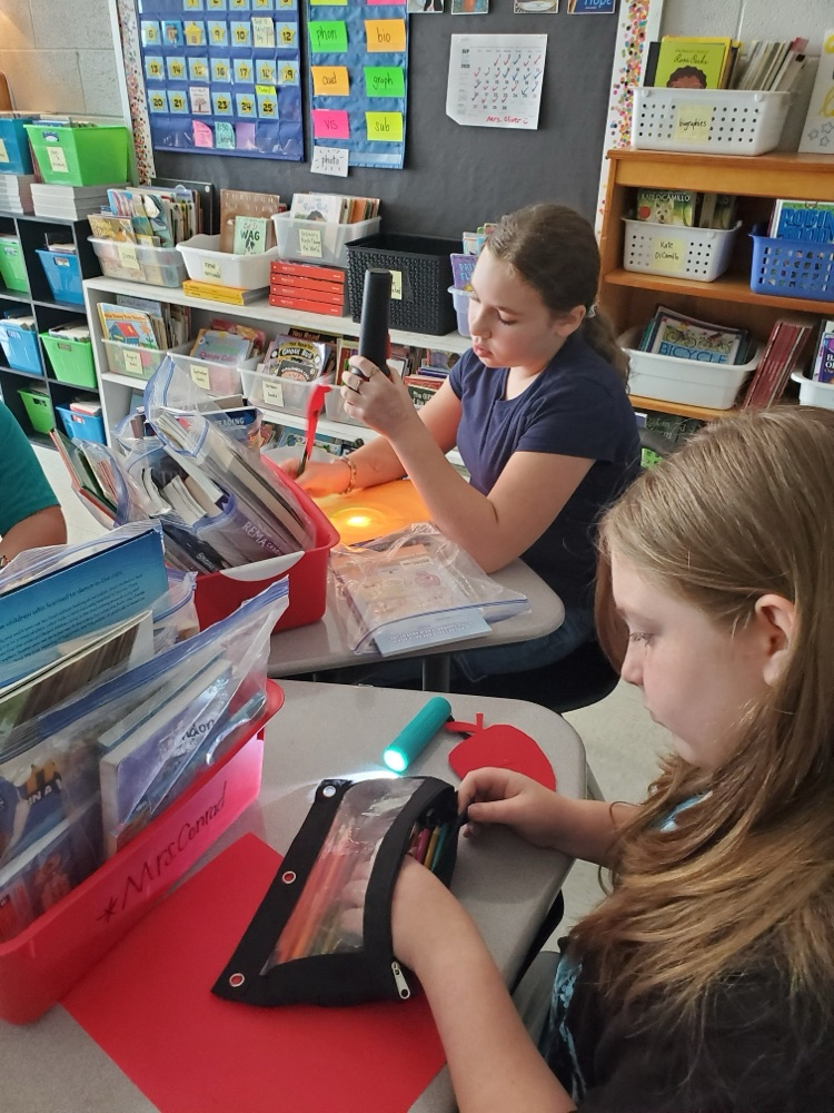 Students used flashlights while working today.