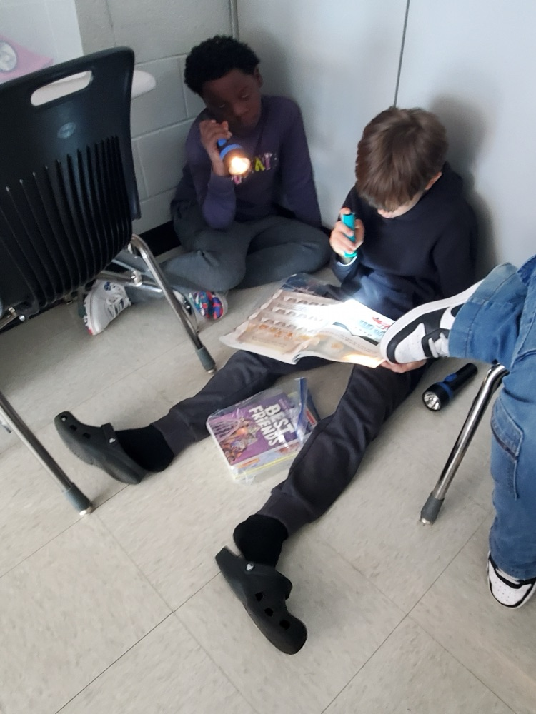 Students used flashlights while working today.