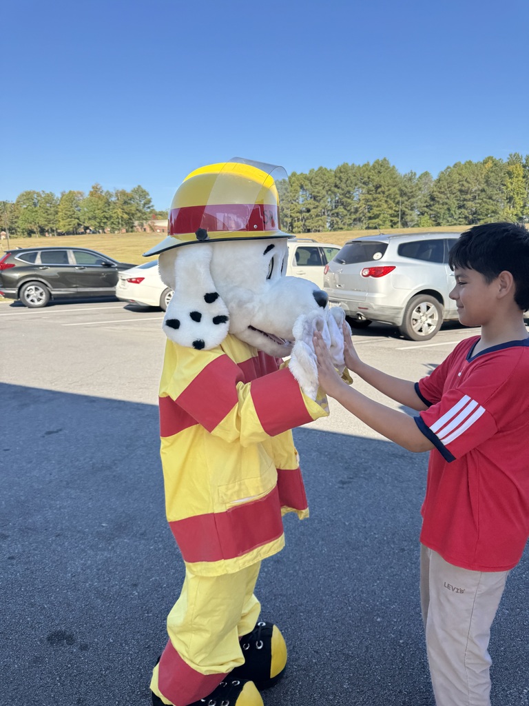 Students enjoy a visit from the fire department.