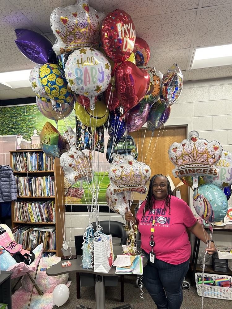 Dr. Campbell poses with her balloons
