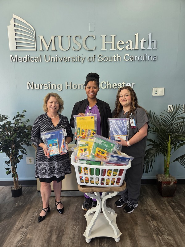 Mrs. Snipes accepting school supply donation