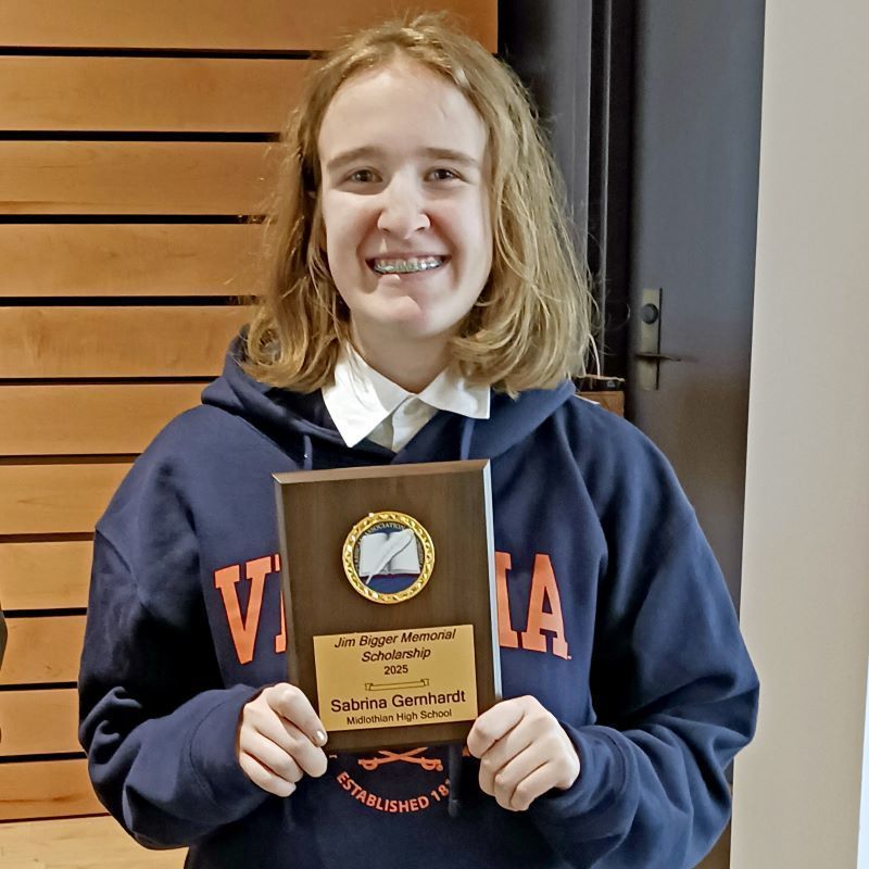 Sabina Gernhardt holding a plaque