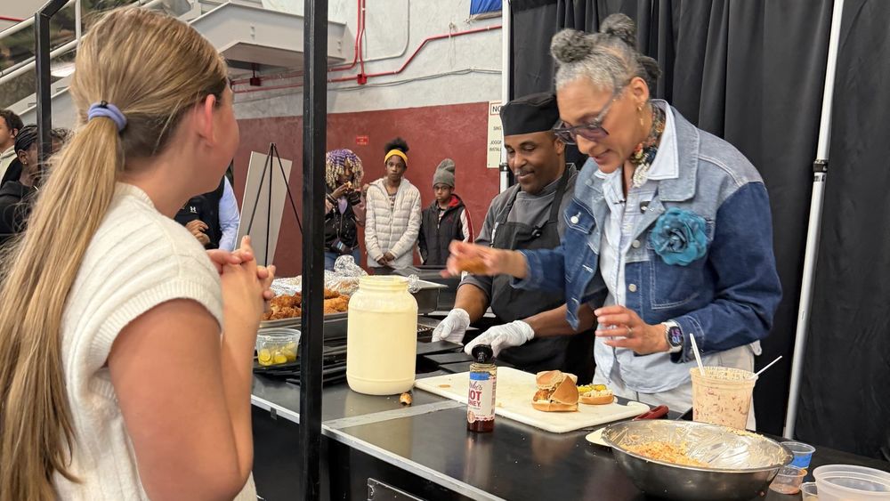 Student watching chefs make food