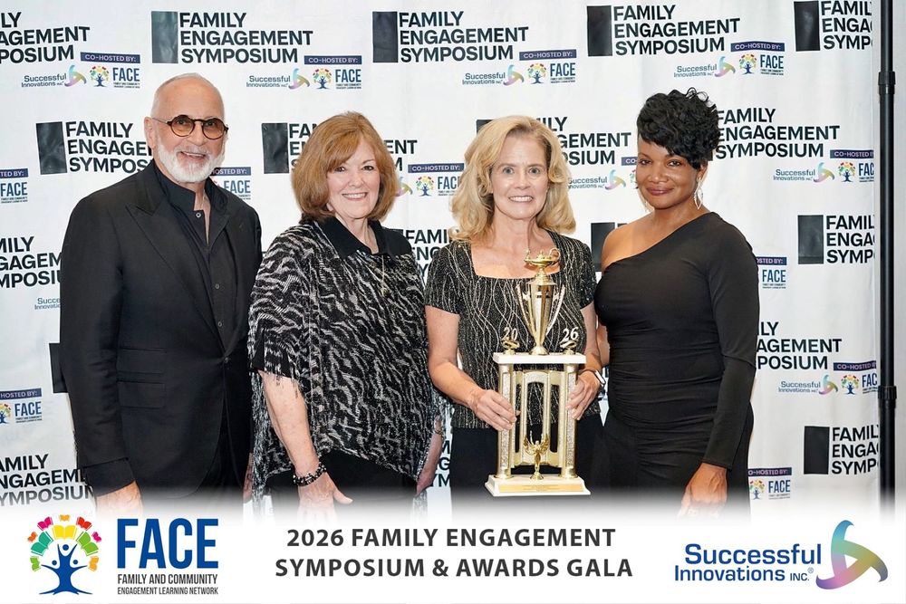 Dr. Randi Smith holding a large trophy with others