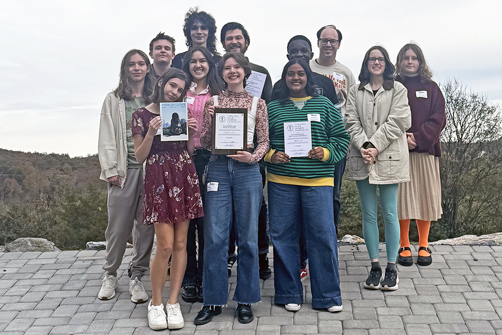 students pose with award