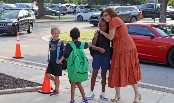 principal greets child on first day of school