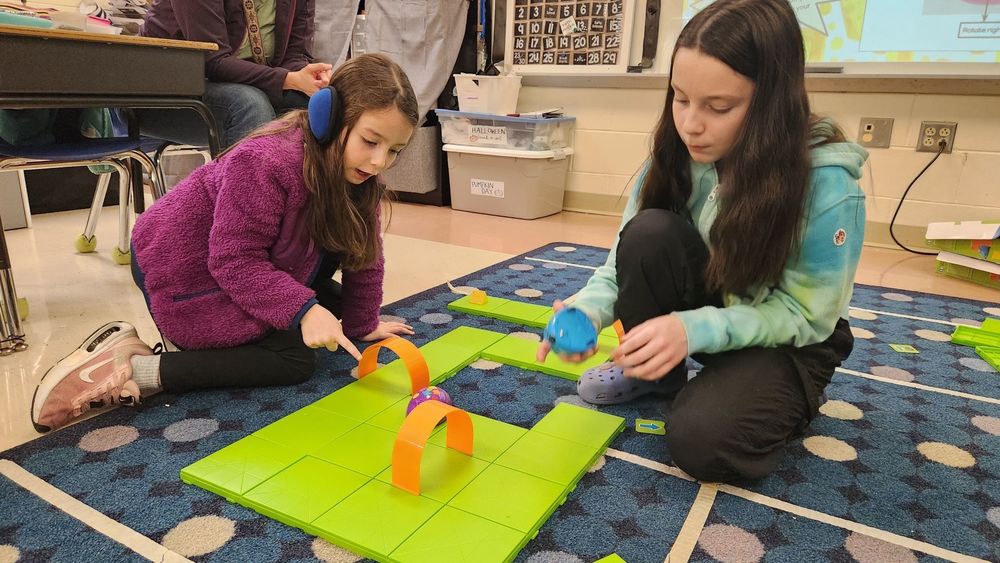 Two students playing a math game