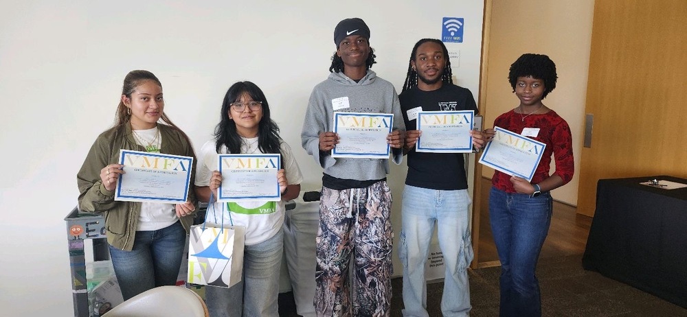 Spanish Immersion student volunteers holding VMFA certificate