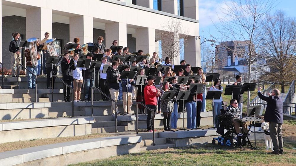 Band performing on large steps