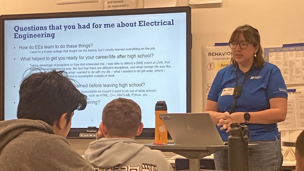 Electrical engineer presenting to students