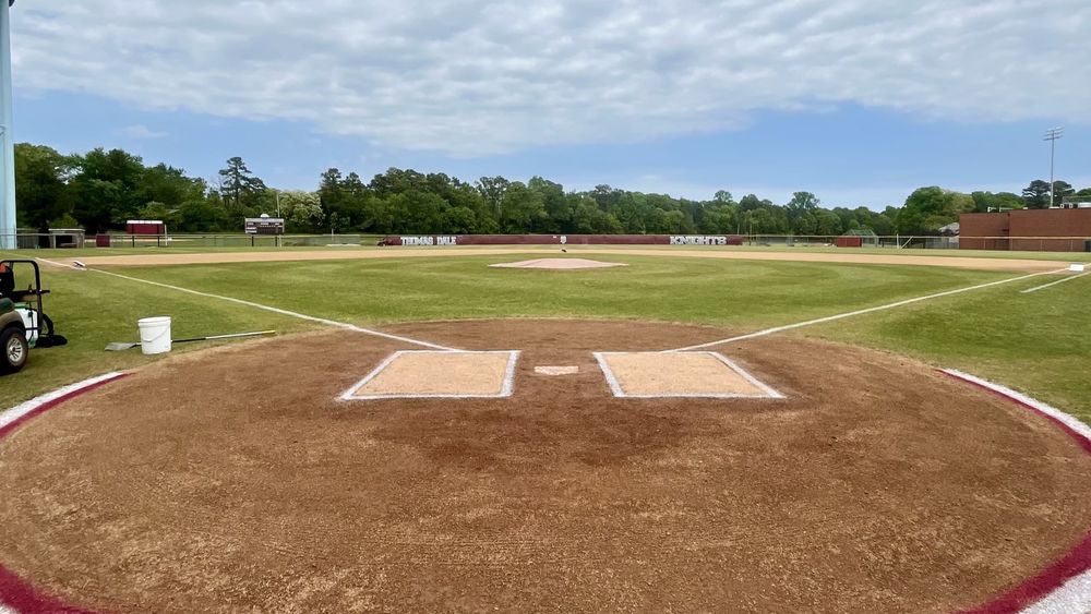 A baseball field view from behind home plate