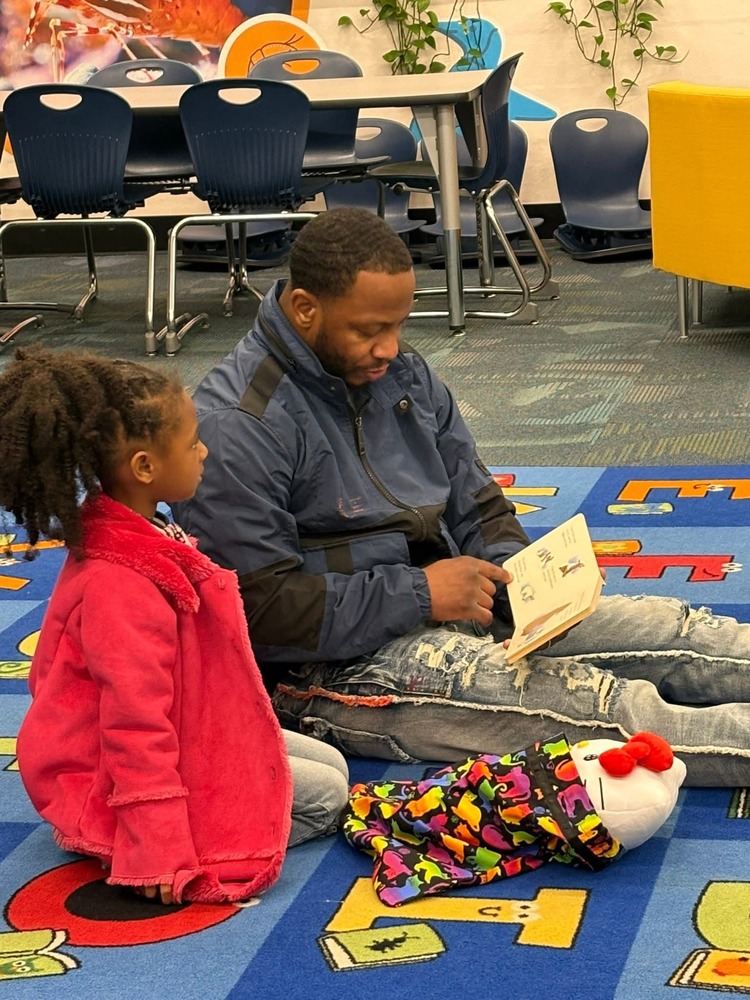 father and student reading