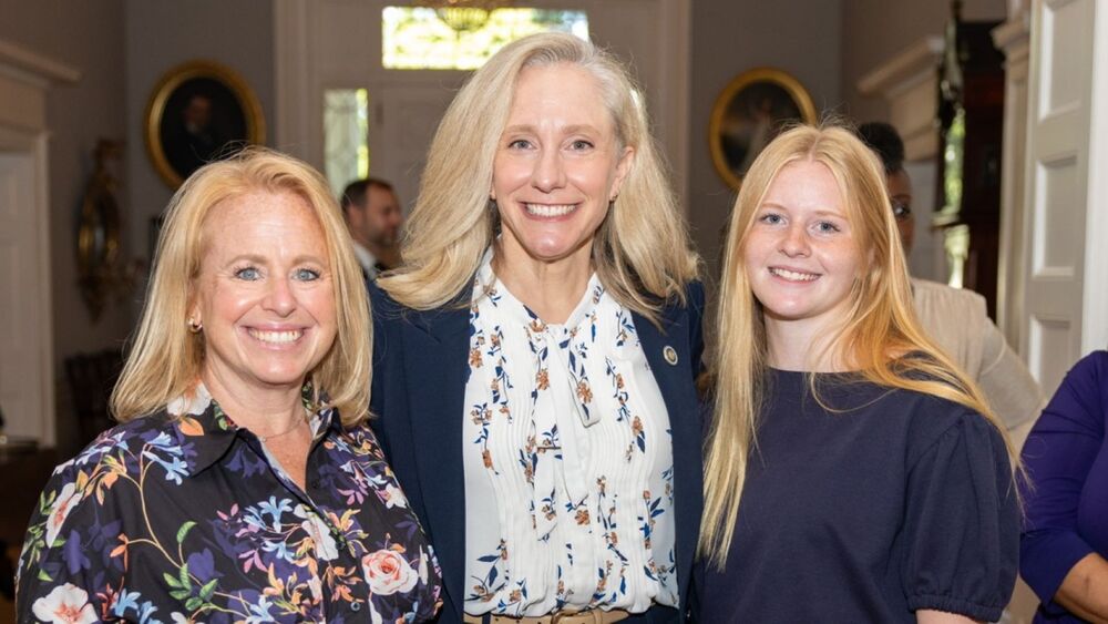 Gov. Abigail Spanberger greeted Matoaca High valedictorian Grace White and her mother, Brandy White, during an essay contest gathering in August.