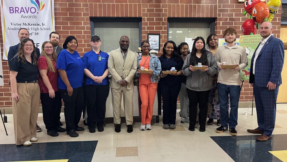 Dr. Craig Reed with students and leadership