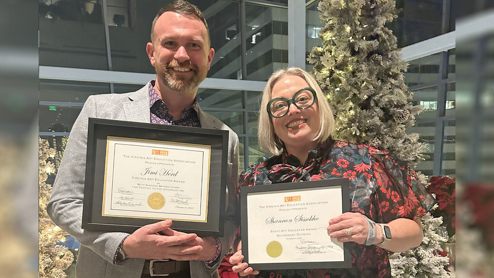 Jimi and Shannon holding certificates