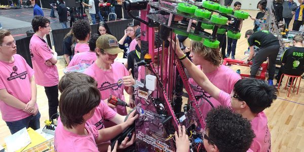 Students working together to build a robot