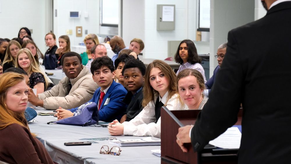 Students watching a speaker intently
