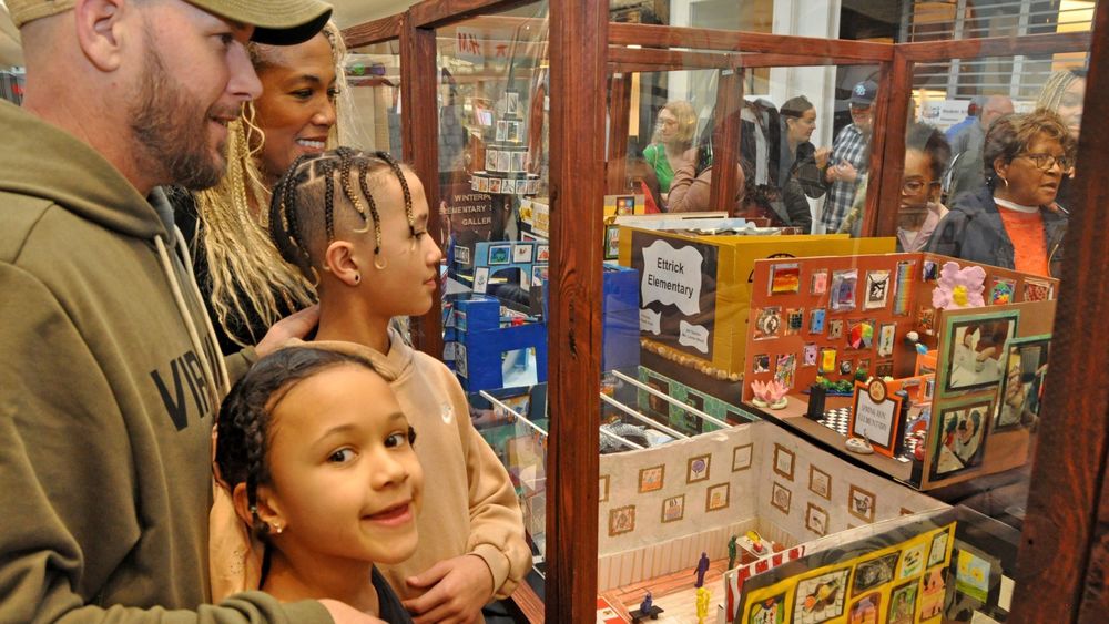 Families looking at Mini Museum