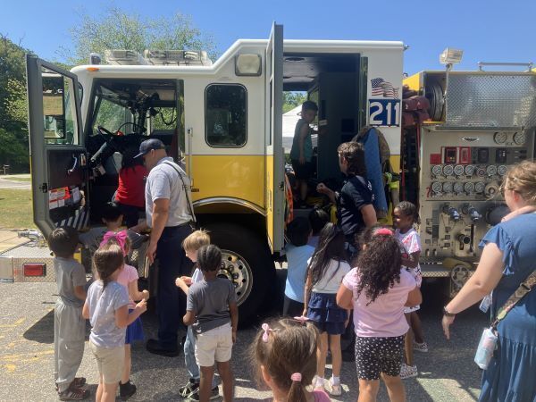 Children exploring a fire truck