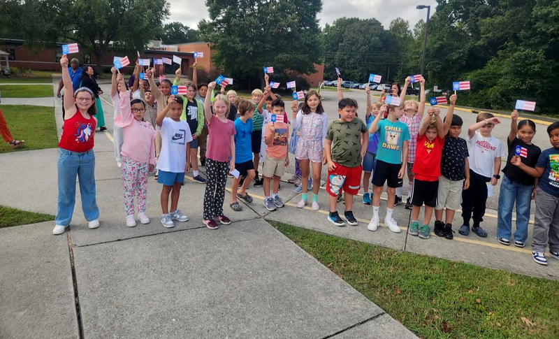 Students holiding up flags
