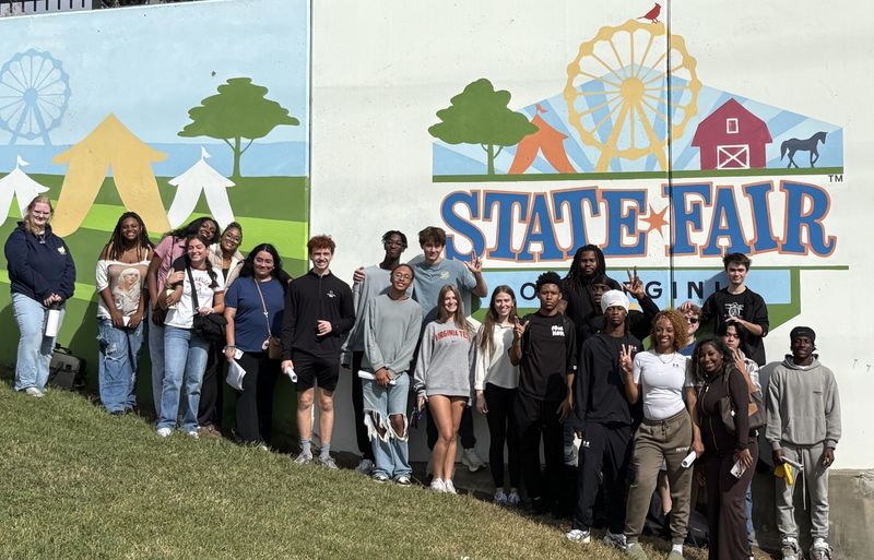 All the students in front of the state fair sign