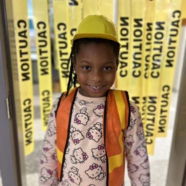 Young girl in a hard hat