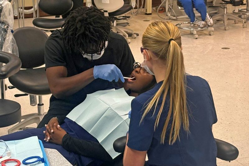 Students doing a dental exam