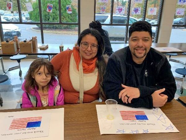 Students smiling with their military family member