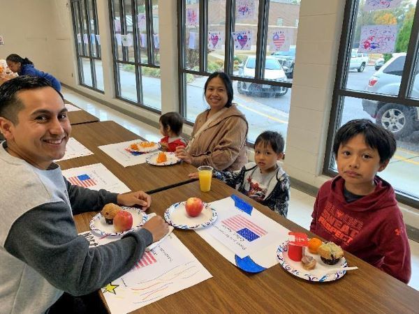 Students smiling with their military family member