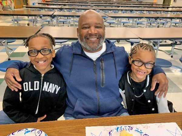 Students smiling with their military family member