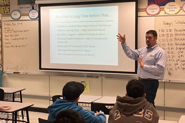 Person speaking to students