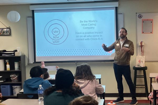 Person speaking to students