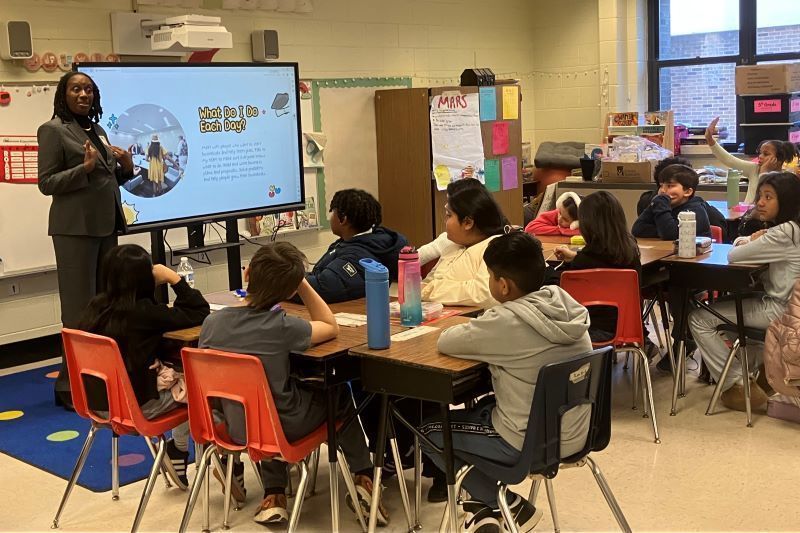 A person presenting to a class