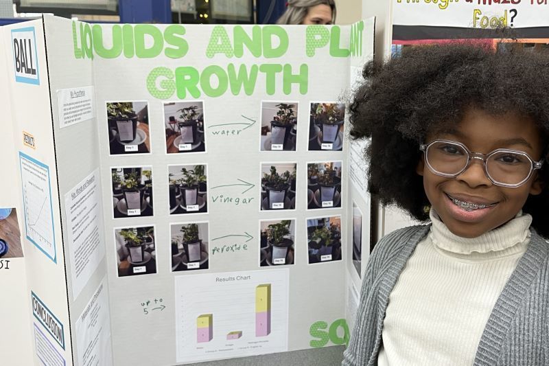 Student with Science Fair project