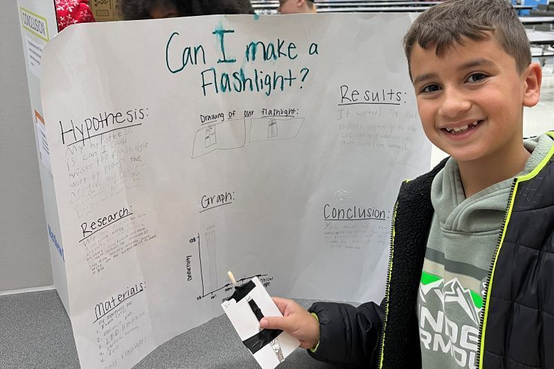 student with science project