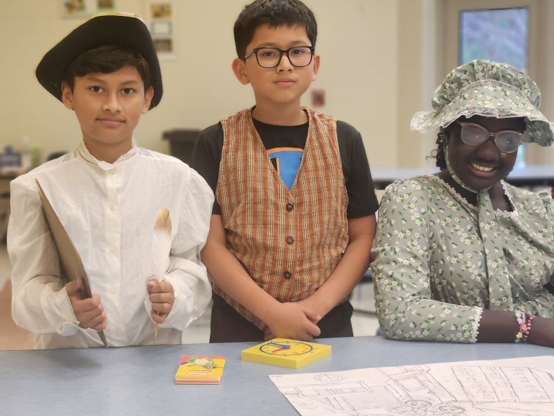 Students dressed in colonial-era outfits