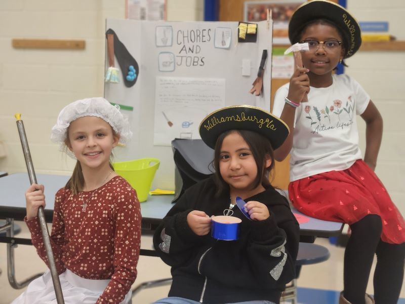 Students dressed in colonial-era outfits