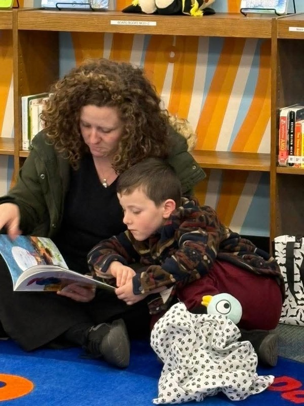 Mother and student reading