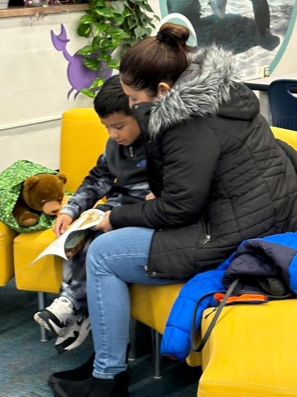 Mother and student reading
