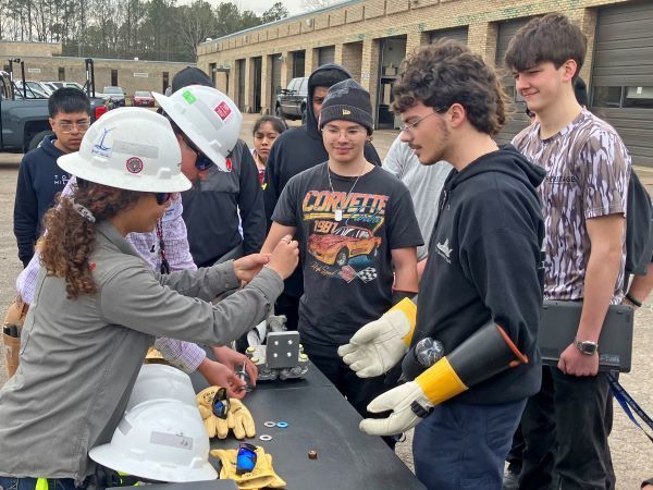 Dominion Energy workers demonstrating equipment