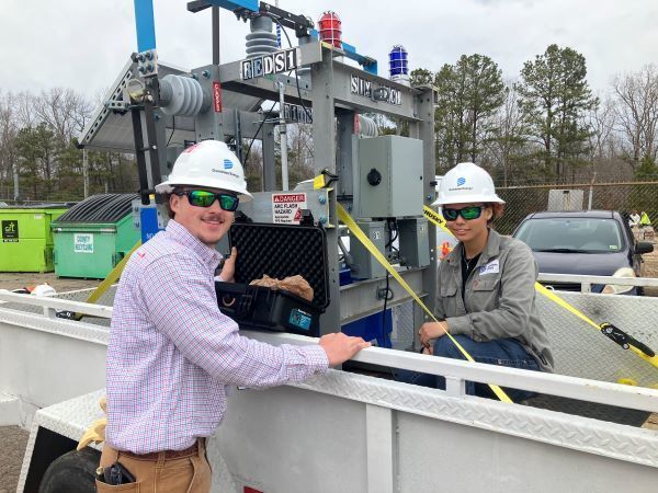 Dominion Energy workers demonstrating equipment