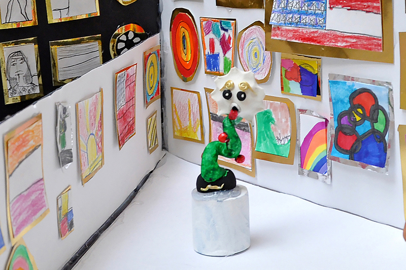 Students and parents looking at art in mall at art show